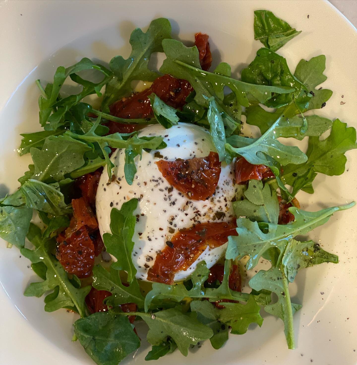 Pick up some Burrata this weekend. Add some arugula and sun dried tomatoes with a splash of good olive oil. Sprinkle some black lava salt on top. So good! #shoplocal #burrata #burratacheese #arugulasalad #goodfood #sundriedtomatoes #supportsmallbusin