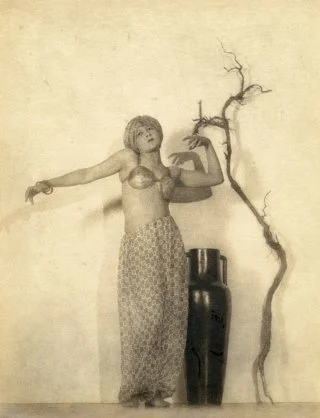 William Mortensen's Rubaiyat of Omar Khayyam is a pictorialist interpretation of a scene from the film by Ferdinand Pinney Earle, depicting the popular book of moral allegory by Omar Khayyam. Mortensen was a successful Hollywood photographer who used stage lighting for dramatic enactments of scenes which predated the birth of photography in 1839.