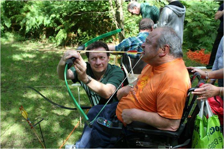 Camper, Clive Bailey, fires a BOW and Arrow with his teeth during the archery activity.