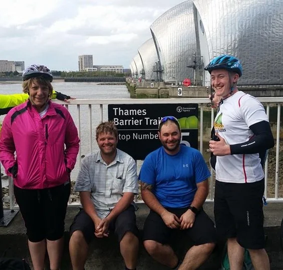 (L-R) Cass Simpson, Mark Richards, Al Stuart and Paul Fox. At the Thames Barrier and all very tired after four days cycling!