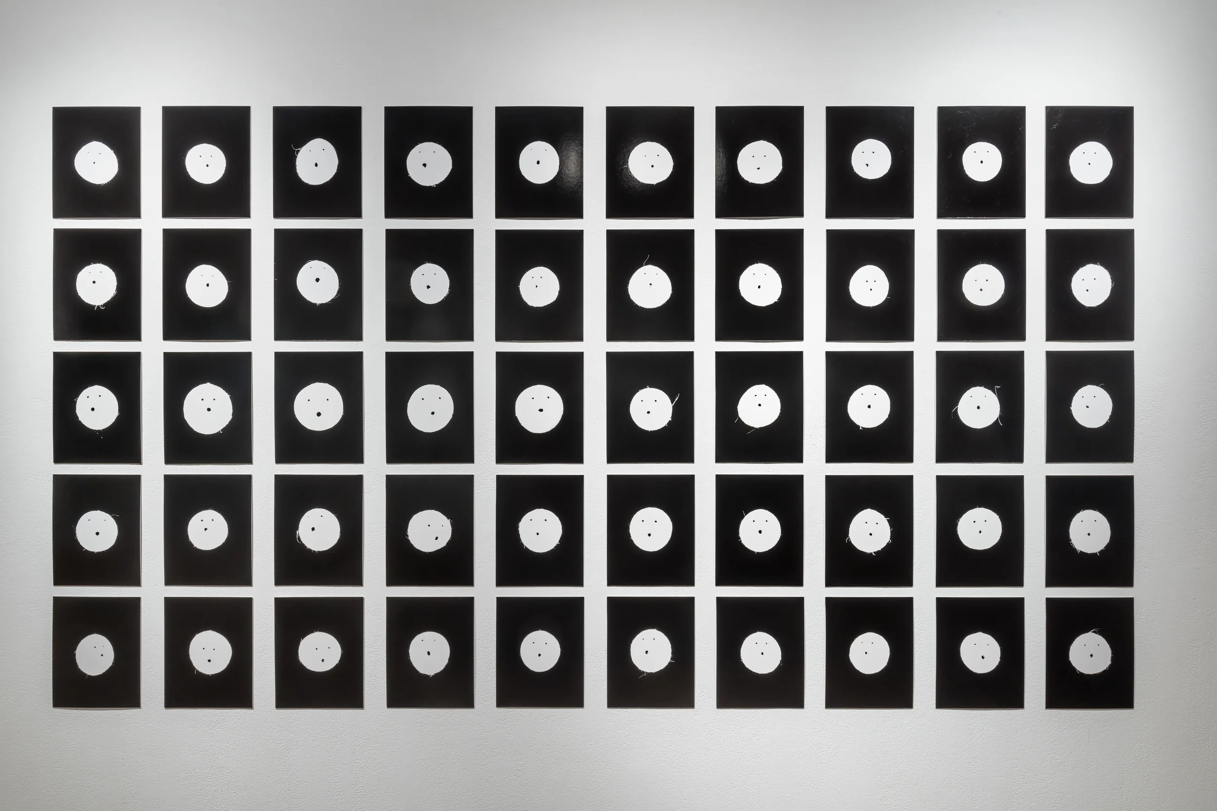 Installation of Faces # 1 - # 50 . Image Credit: Toni Hafkenscheid