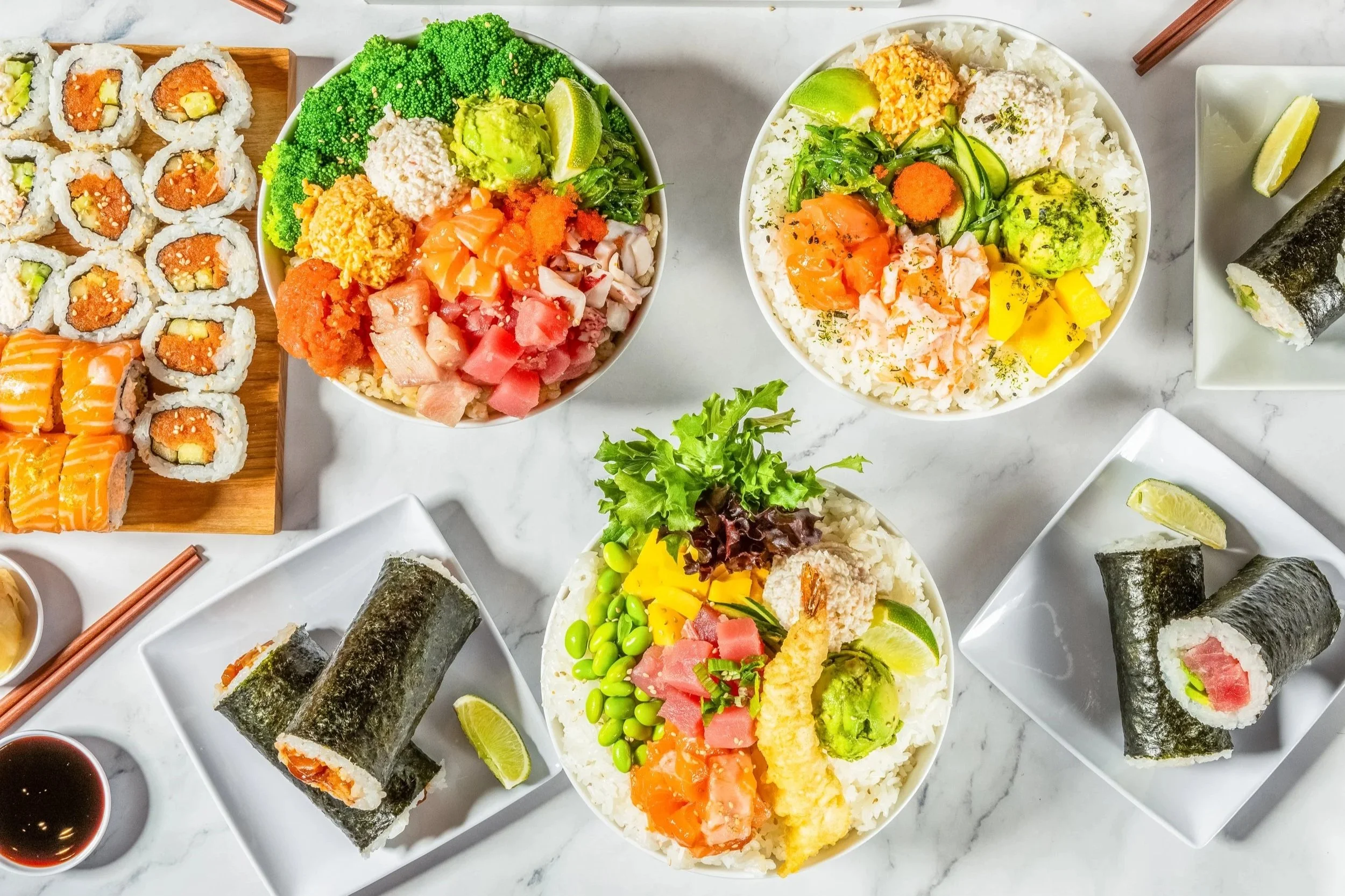 Fresh poke bowls and sushi rolls with salmon, tuna, and vegetables at Uroko Poke