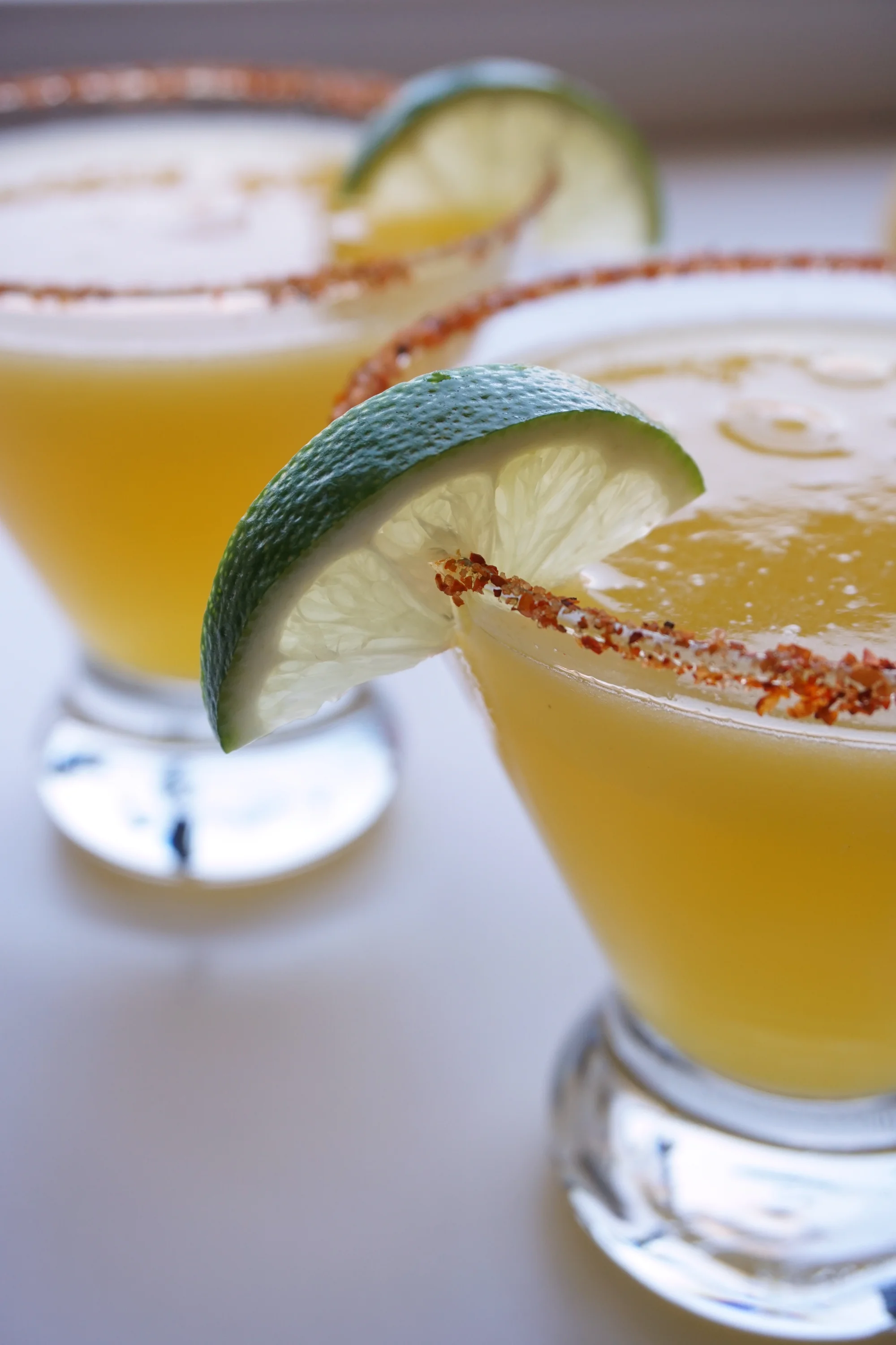 Tajín Rimmed Mango Margaritas