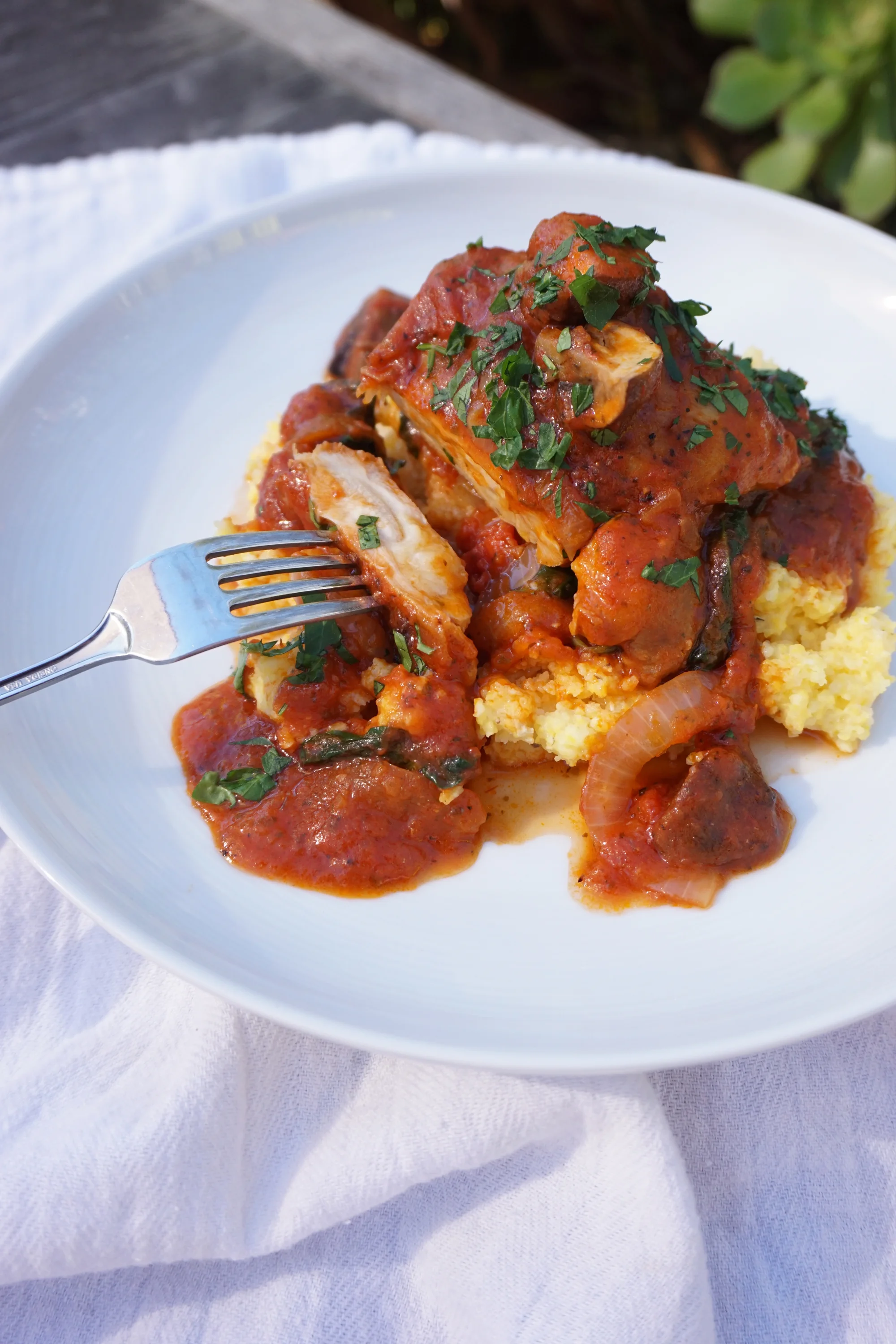 Tomato Braised Chicken and Mushrooms over Polenta