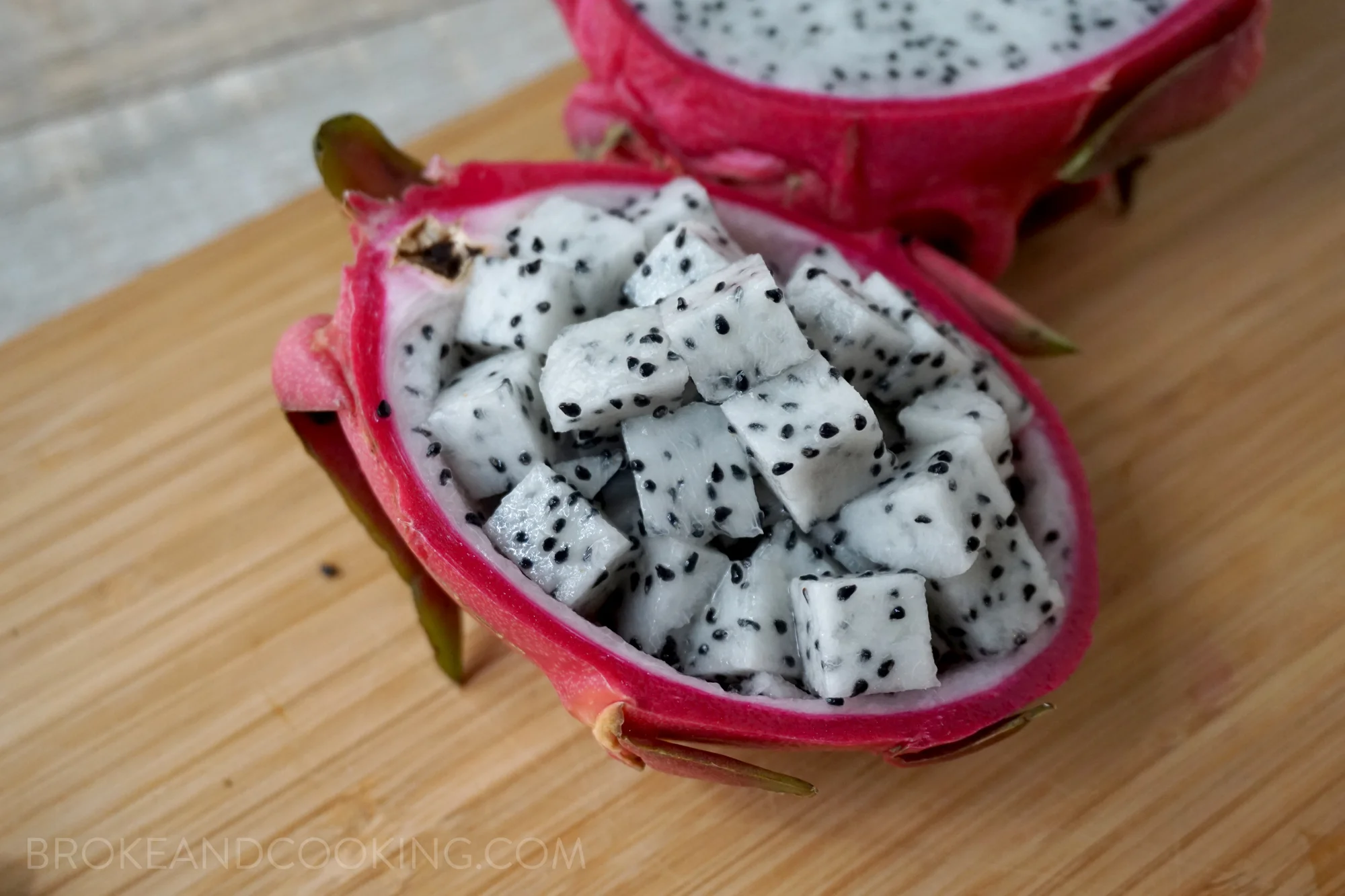 To cut a dragonfruit, slice the fruit in half length-wise, and use a spoon to scoop out the flesh of each halve (just like you would for an avocado). Then slice or dice up the gorgeous fruit! 