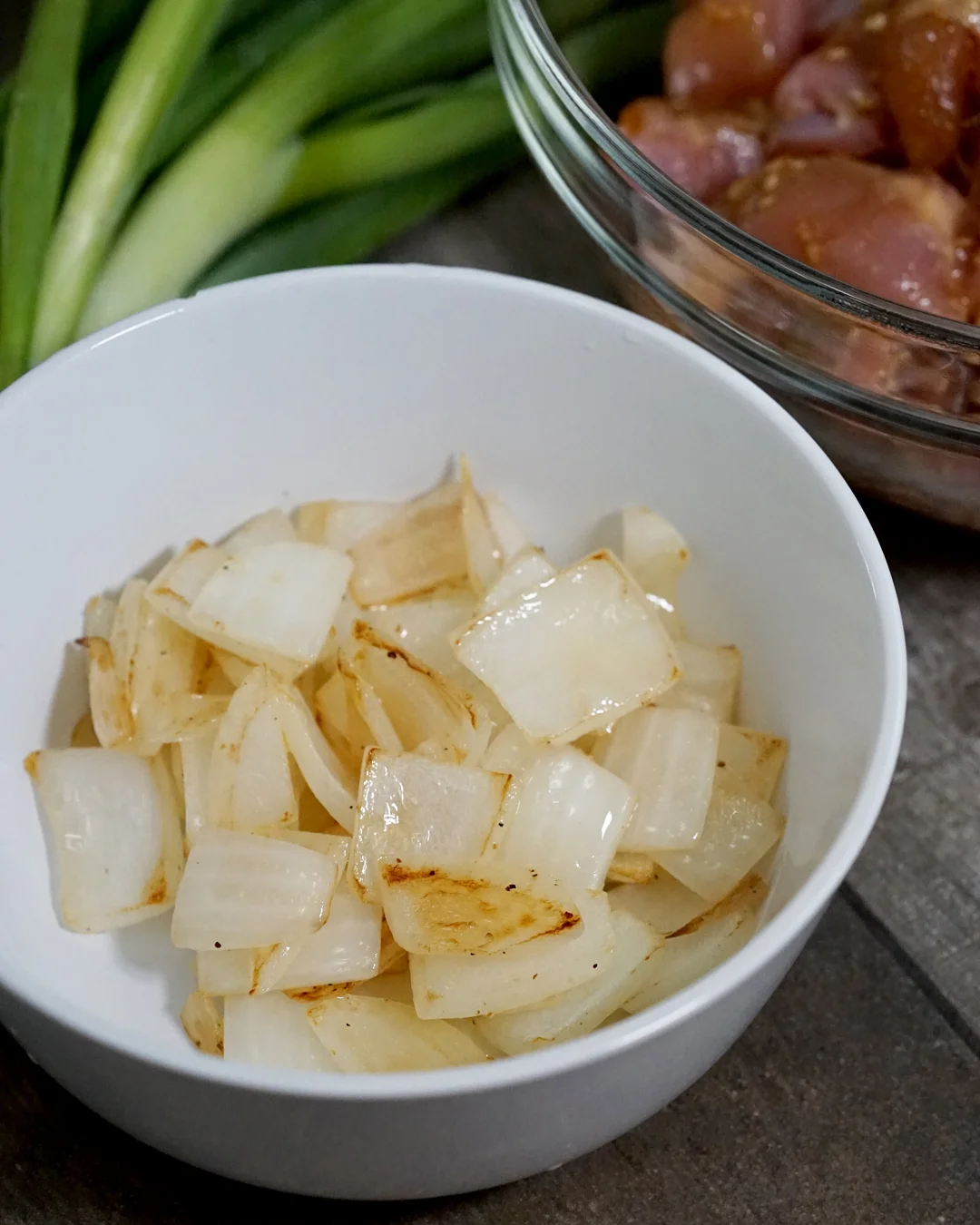 Chop the onions into 1/2” pieces. Heat a large pan over medium heat. Saute the onions in olive oil, seasoning with salt and pepper until almost translucent. Remove from the pan and place aside.