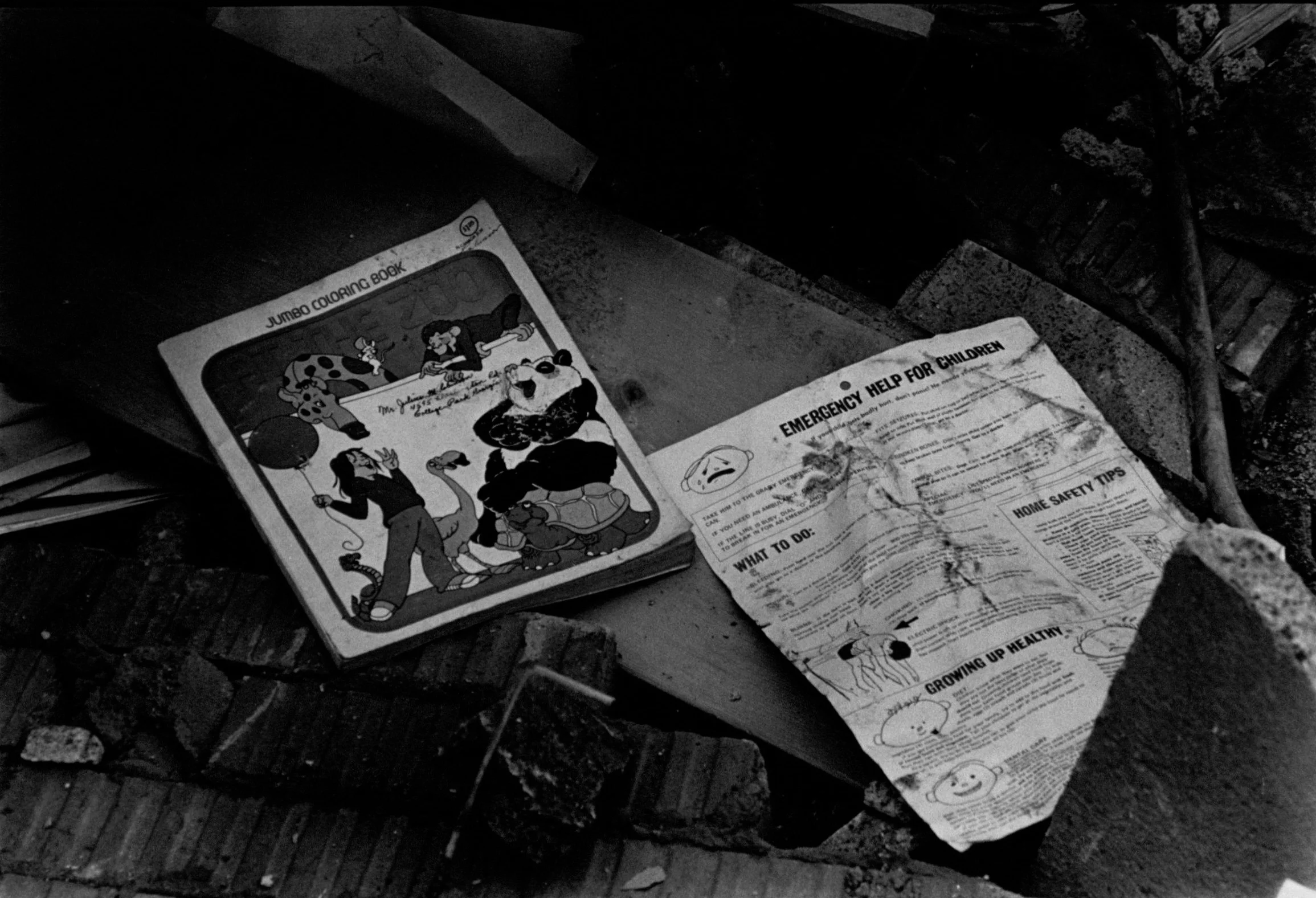 School books and debris from the Bowen Homes Explosion. Photograph by Jerome McClendon (1980) Atlanta Journal-Constitution Photographic Archives. Special Collections and Archives, Georgia State University Library.