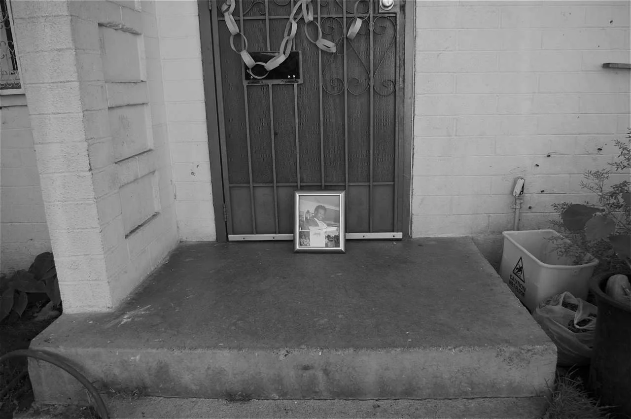 The front step where Maurio was shot in 2008. Sherika says she found him slumped over, halfway off the porch and partially in the bushes. Sahra Sulaiman/LA Streetsblog - View more of Sherika's story here . 