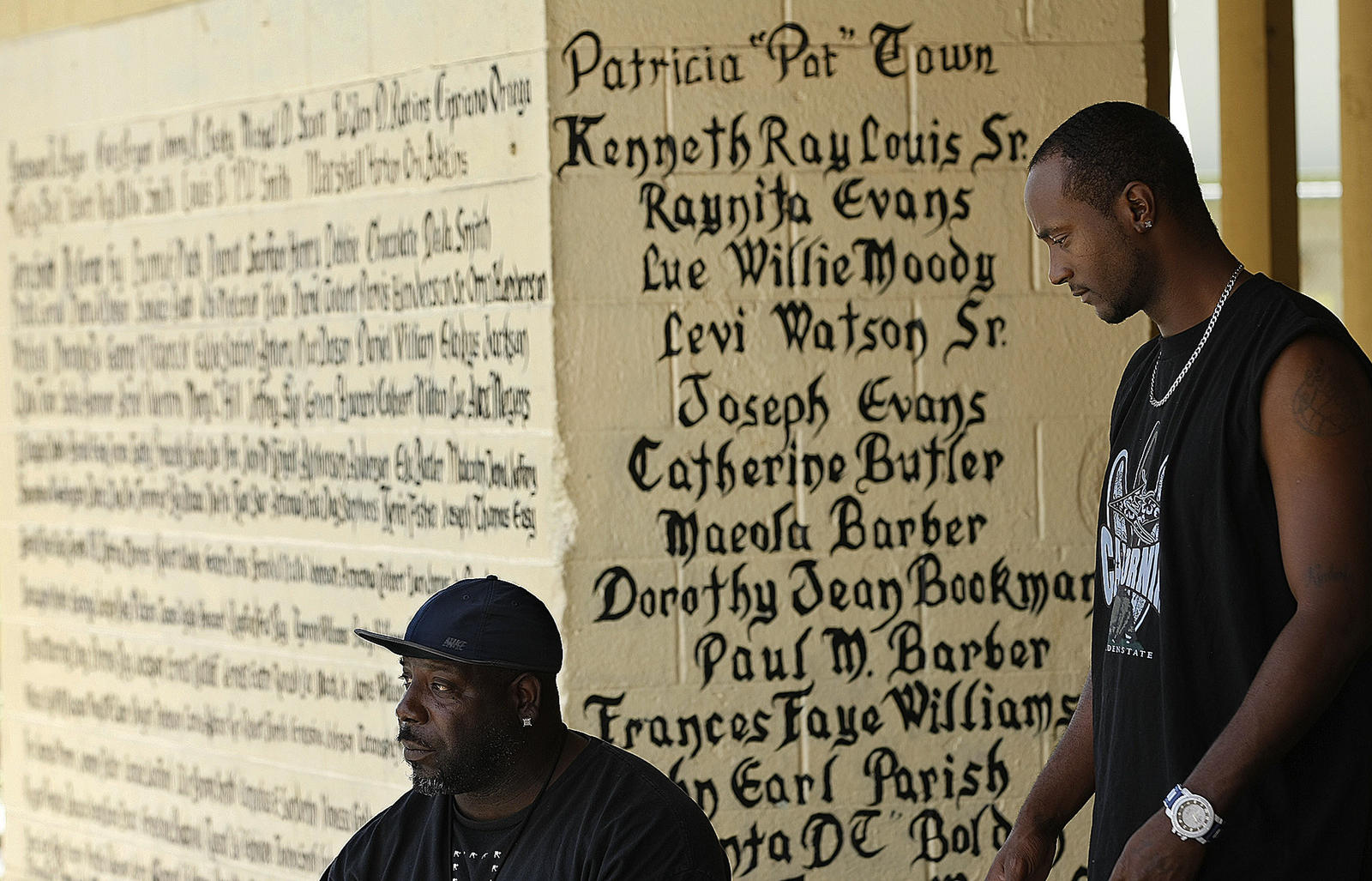 Eddie Williams, 44, left, and Louis Smith, 31, at 'the wall' L.A. Times