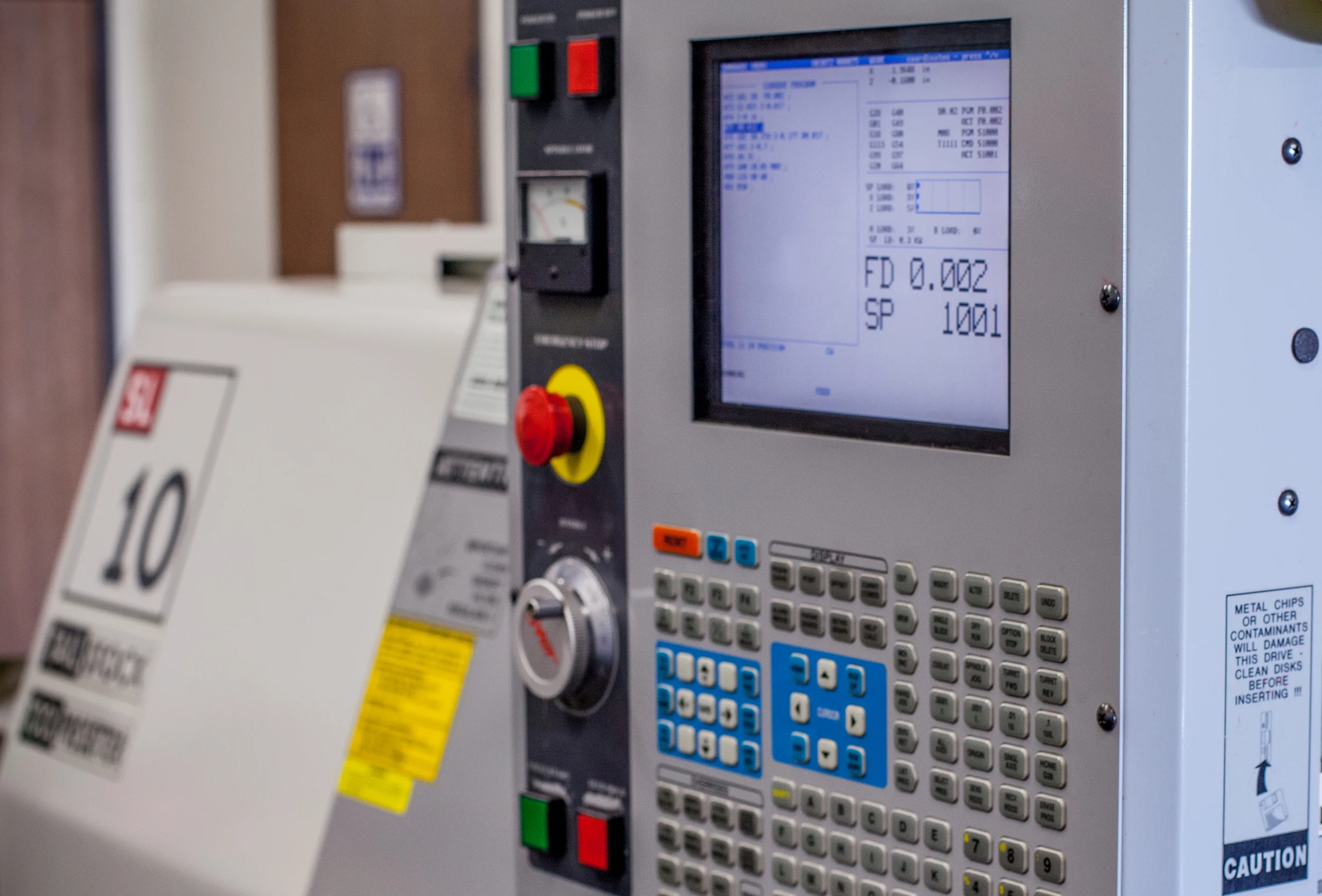 The computer controlled lathe that is used to make each of the parts for the EDC ink pens.