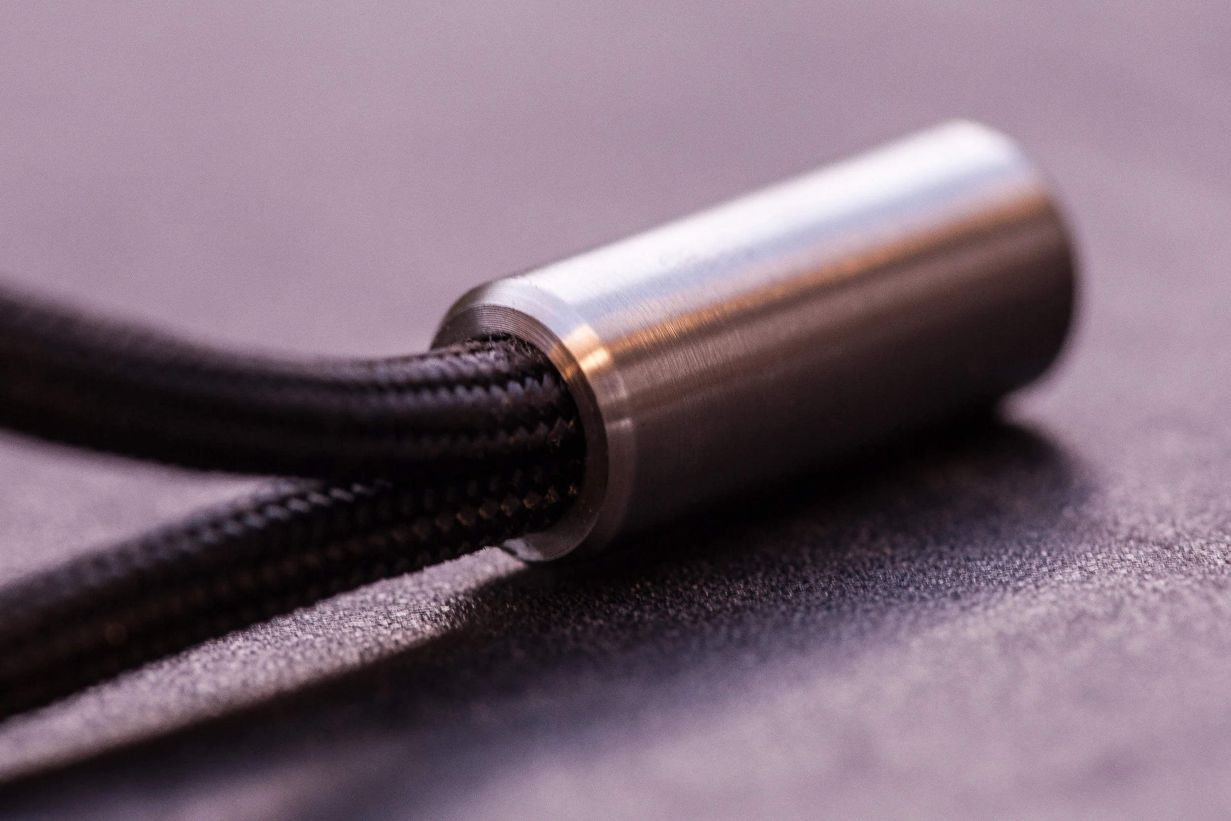 Close up detail of the Cord Lock with black 550 paracord.