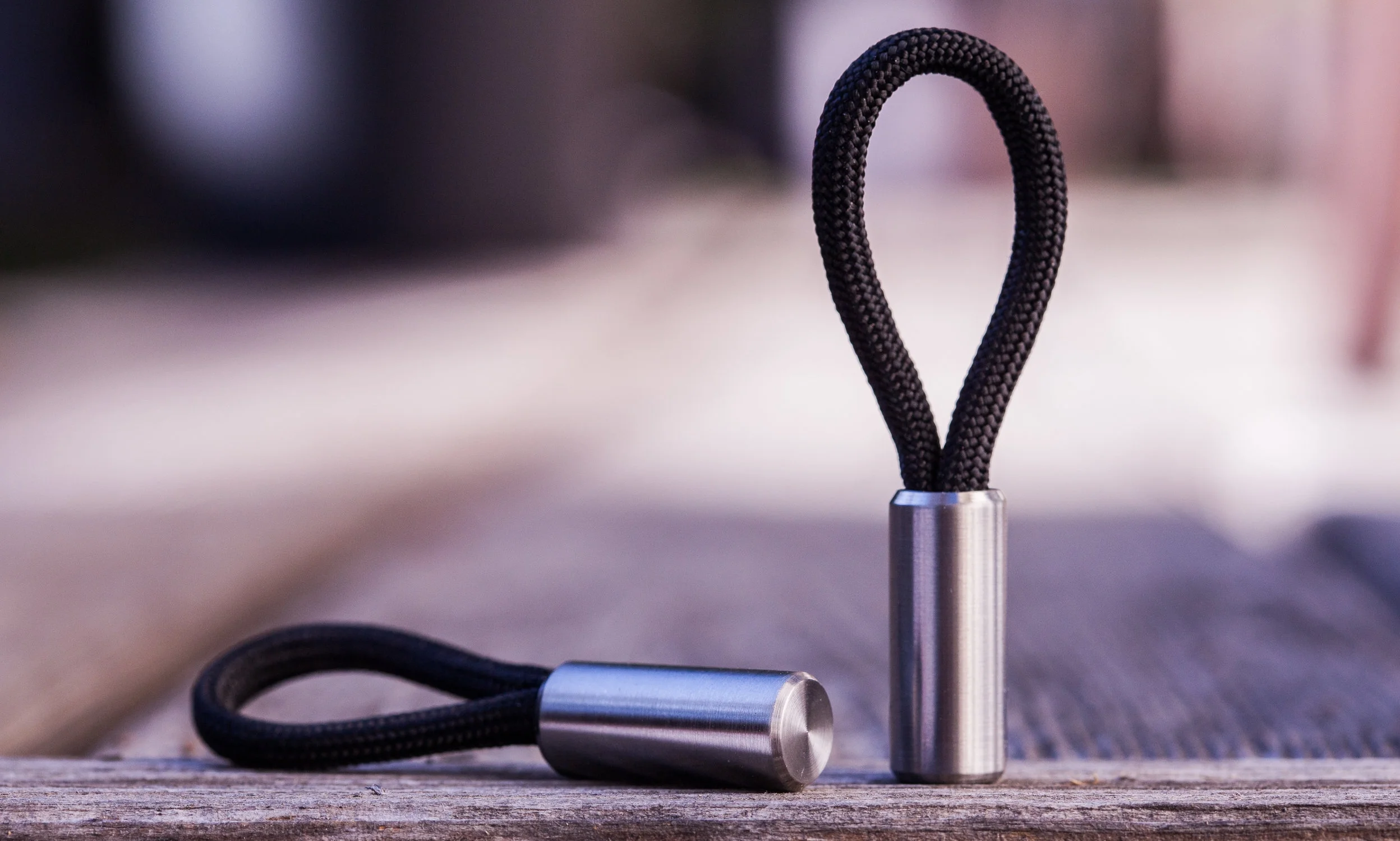 550 paracord closure - round titanium version of the Cord Locks.