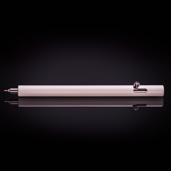 Cerakote Stormtrooper White version of the Injector titanium bolt action pen, shown the table.