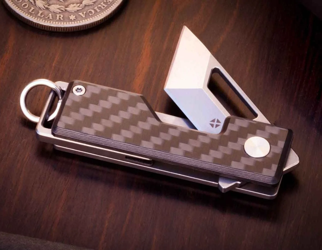 Carbon version of the Pocket Tanto EDC keychain knife with the blade partially open - showing the bottom of the knife.