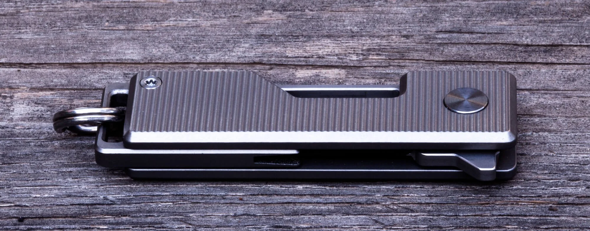 Pocket Tanto keychain knife closed on table