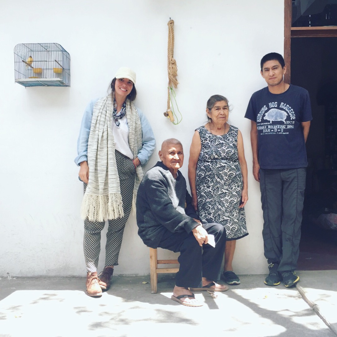 Emiliano, center, Delfina, and their youngest son, Gabino, in the courtyard of their family home in the Oaxaca Valley. 