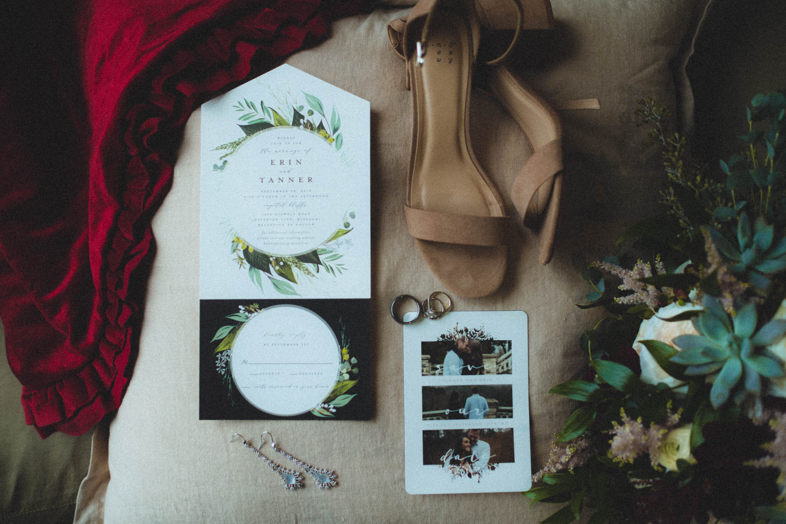 detail photo of wedding invitations and stationary with bride's shoes