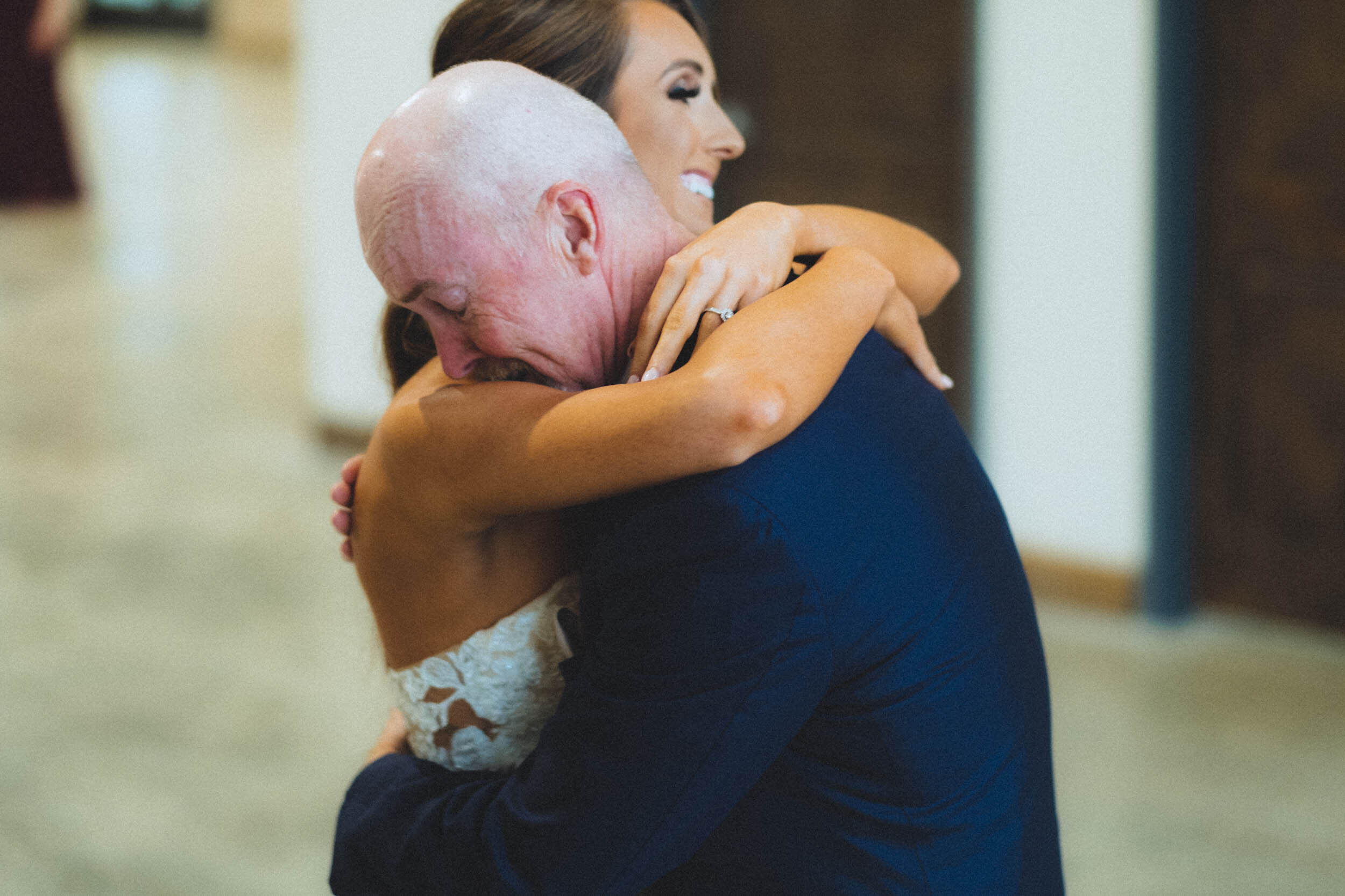 bride and father hugging