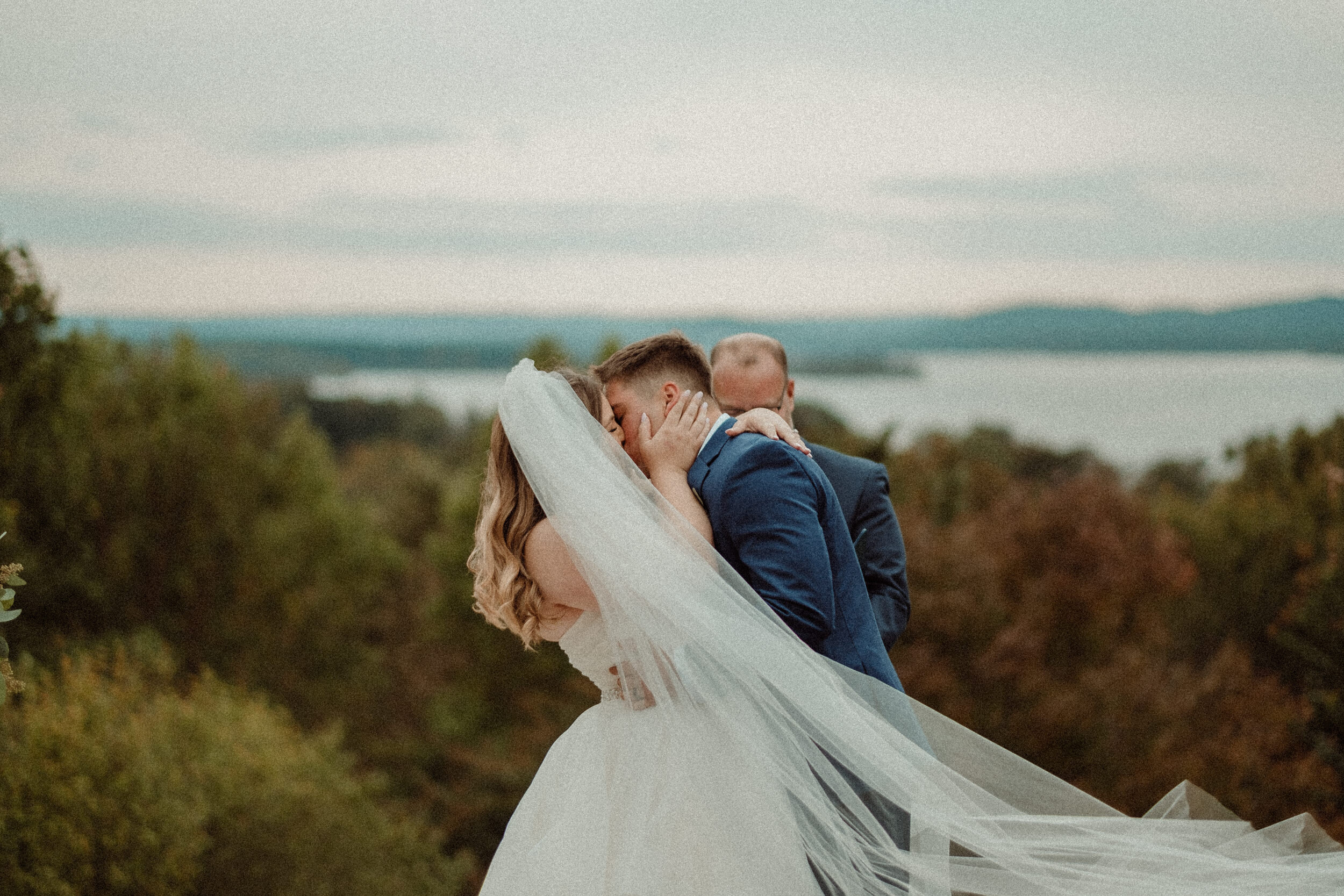 wedding ceremony kiss at table rock lake in Branson