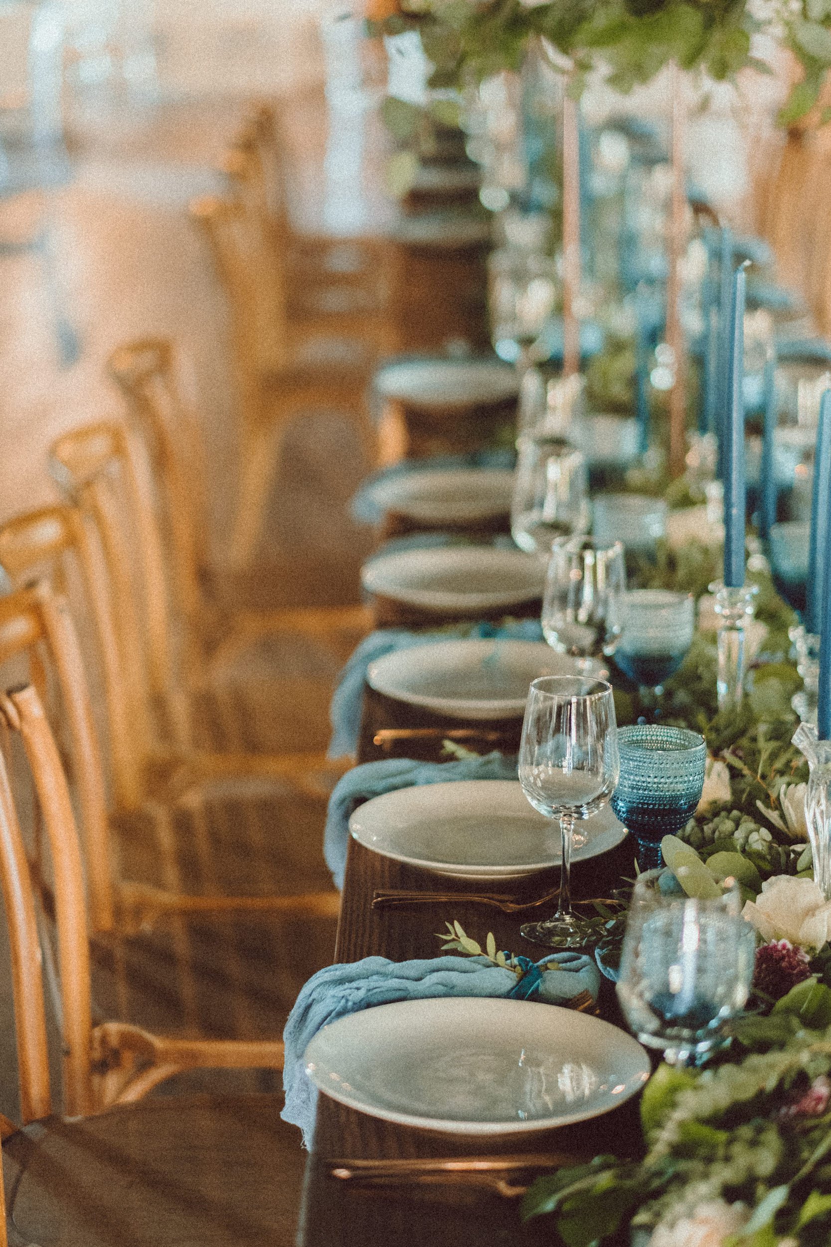 Blue napkins wooden chairs wedding reception