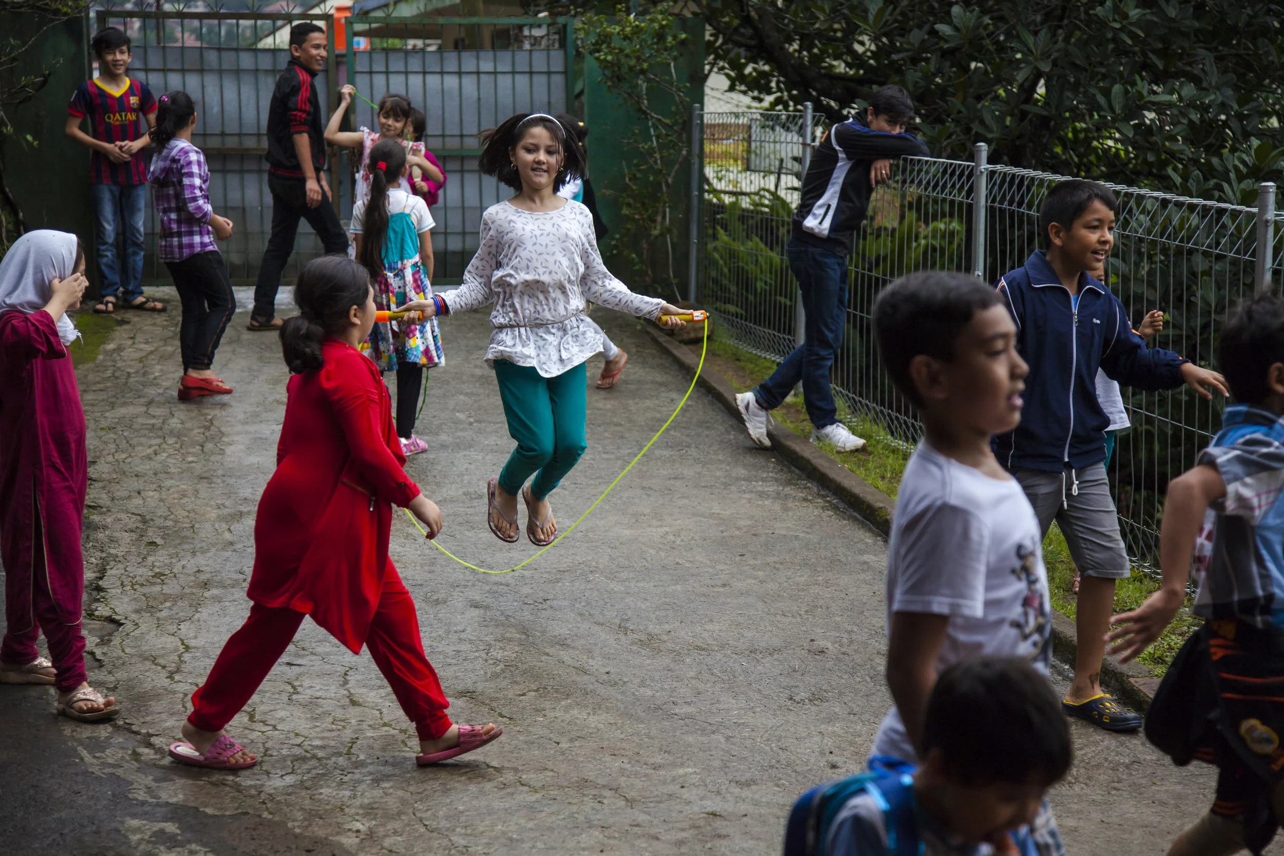 Refugee children play during a break at the Cisarua Refugee Learning Centre. Cisarua, Indonesia. 