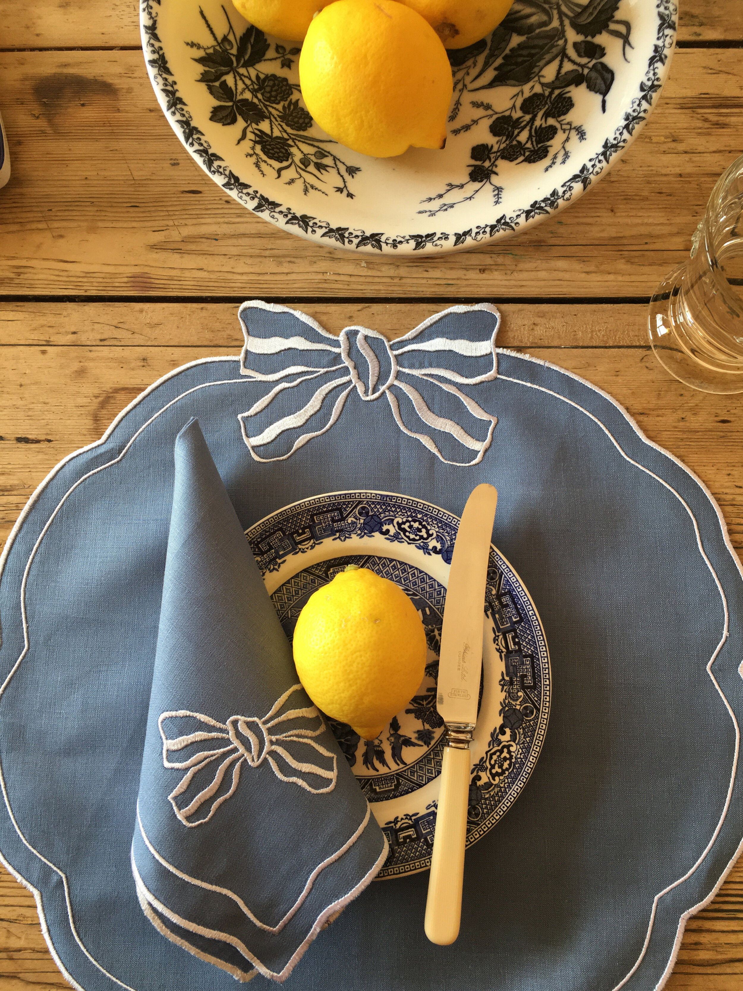 isla-simpson-for-rebecca-udall-candy-bow-placemat-denim-lemons 2.jpg