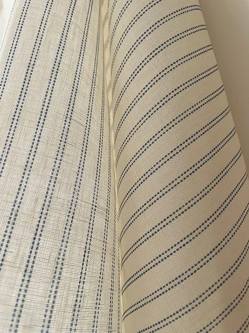 Close detail showing the weave structure of the Cornflower Blue Pillow Stripe fabric.