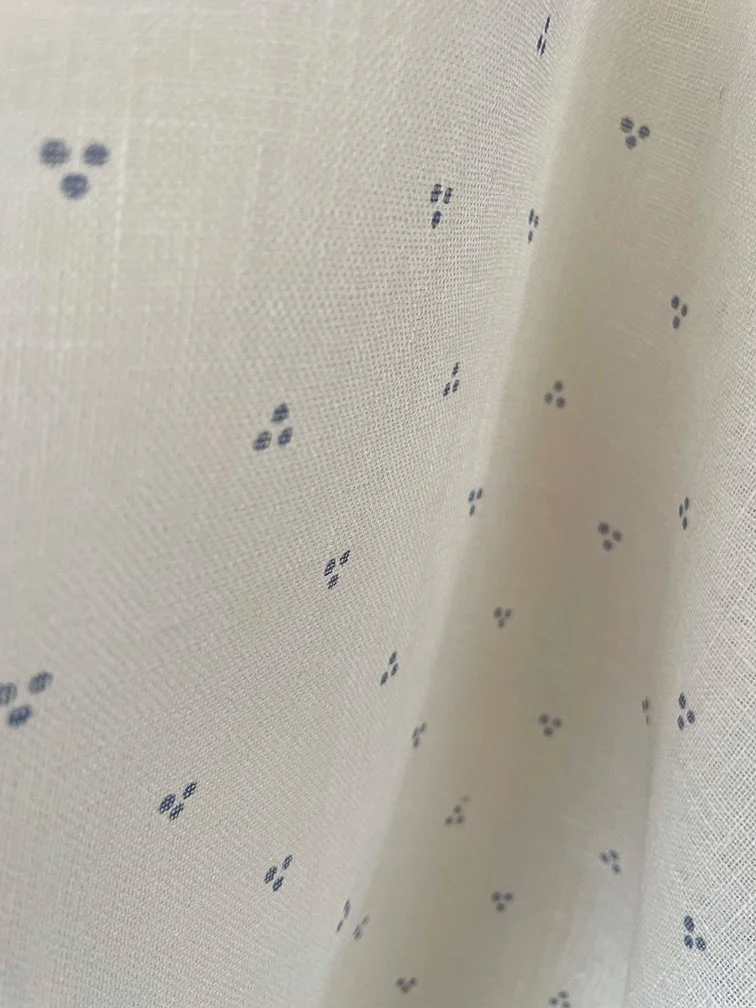 Close view of Petite Trio of Dots in Faded Blue, focusing on subtle three-dot repeat.