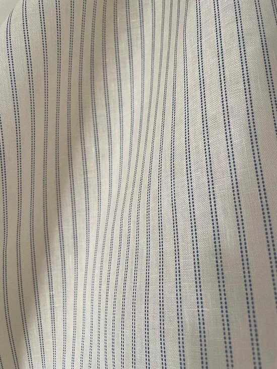 Detailed shot of Cornflower Blue Pillow Stripe fabric with focus on pattern precision and yarn texture.