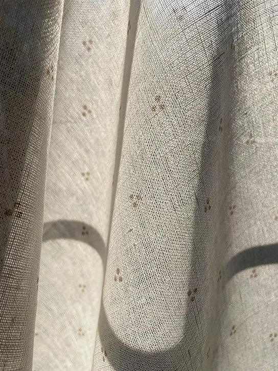 Window pane visible through Petite Trio of Dots Clay, demonstrating semi-sheer quality.