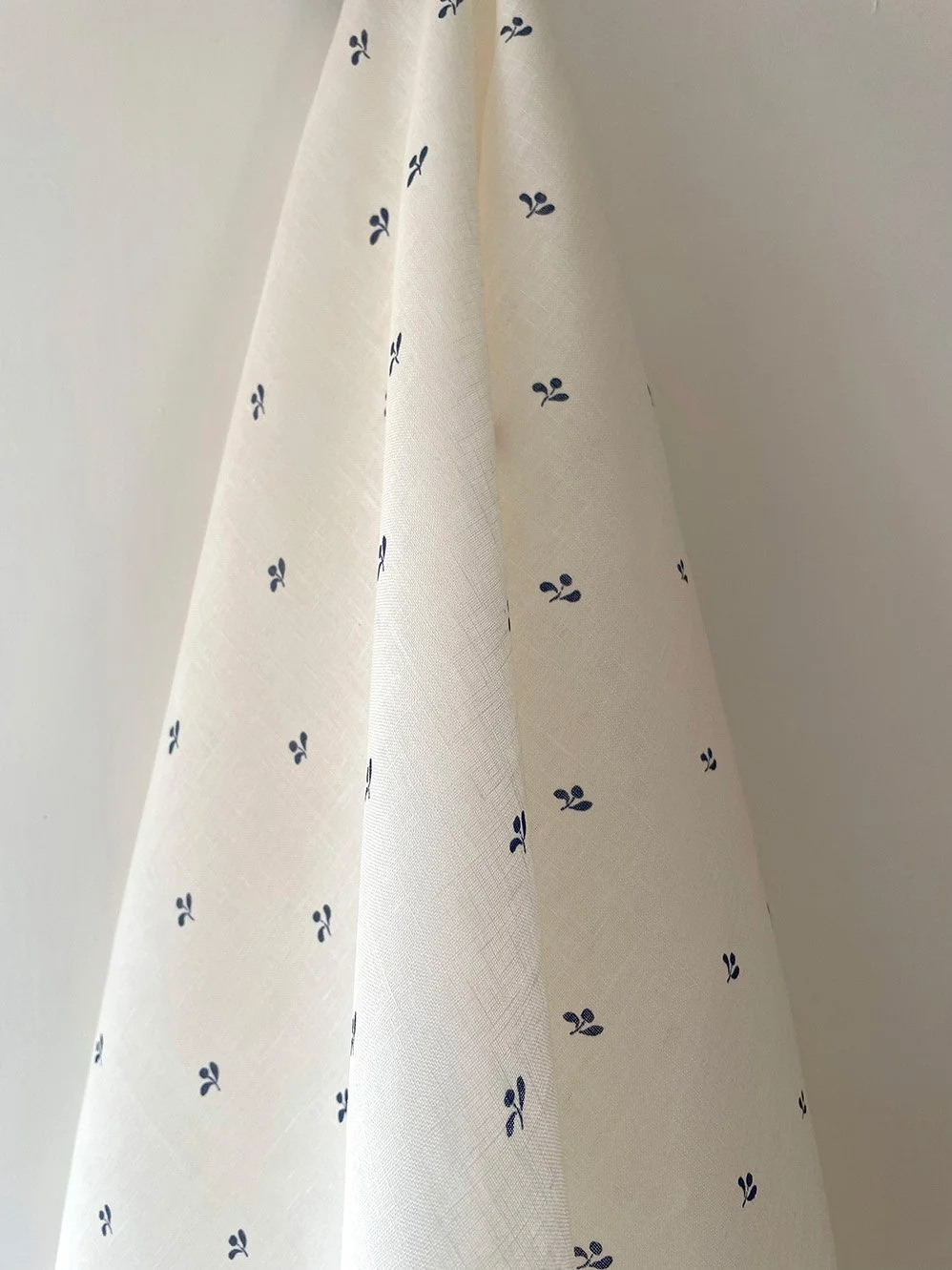 Lawn Flower ironstone blue fabric draped to show soft movement and midweight handle