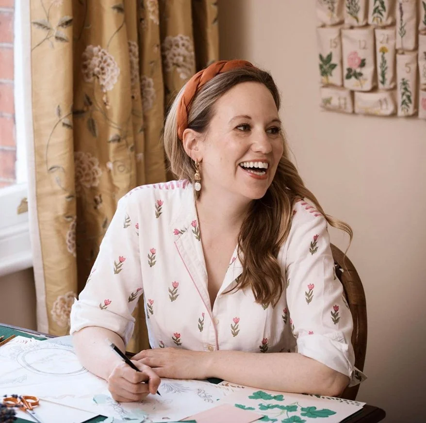 Founder and Designer Isla Simpson sat at her studio desk