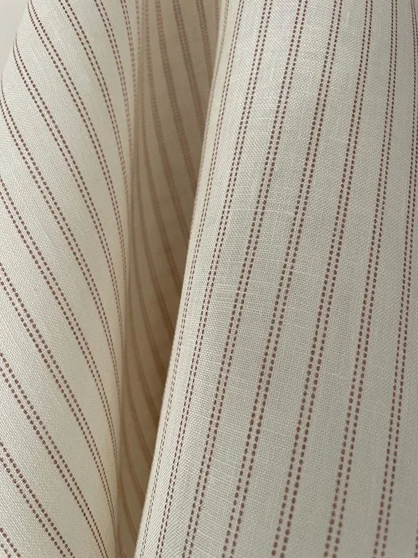 Macro view of Pillow Stripe fabric pattern in marsala pinkrevealing subtle weave structure