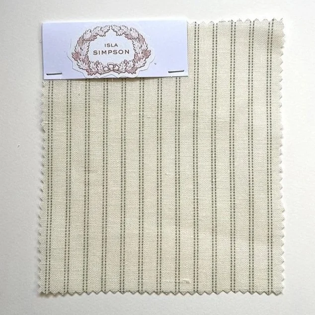 Pillow Stripe swatch with branded header on neutral background, showcasing colour and weave detail.