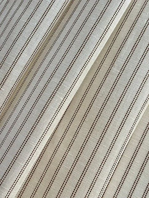 Pillow Stripe fabric in saddle brown gathered in soft folds to showcase flexibility and pattern rhythm