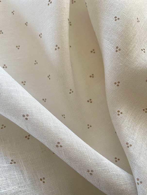 Clay Petite Trio of Dots arranged in natural, soft curves, revealing dot pattern across the fabric.