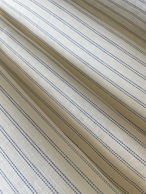Cornflower Blue Pillow stripe fabric gathered in soft folds to showcase flexibility and pattern.