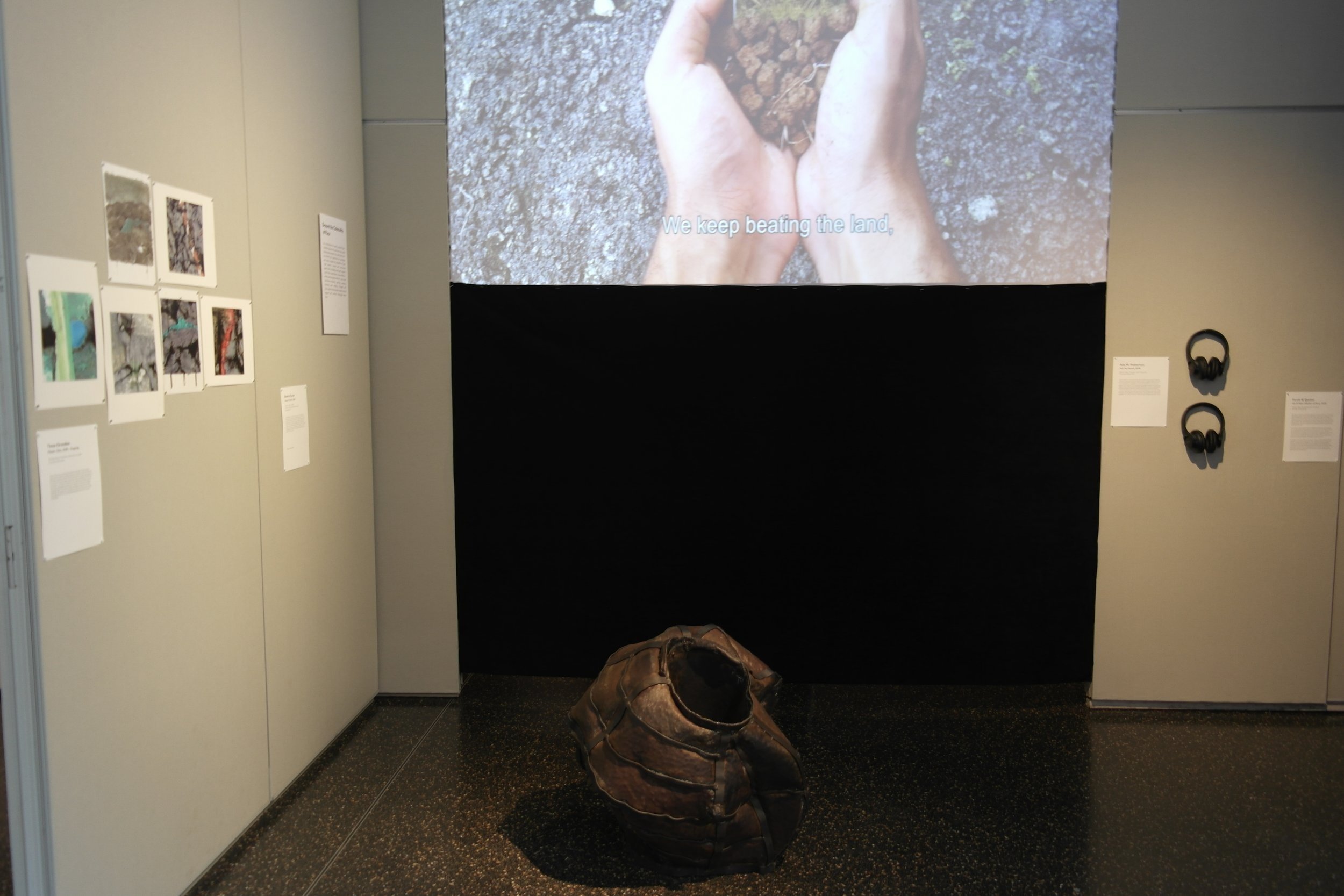 Gallery view with works by Tessa Grundon (Plastic Tides), Beatriz Cortez (Glacial Pothole), and Ada M. Patterson (Yuh Too Sweet).