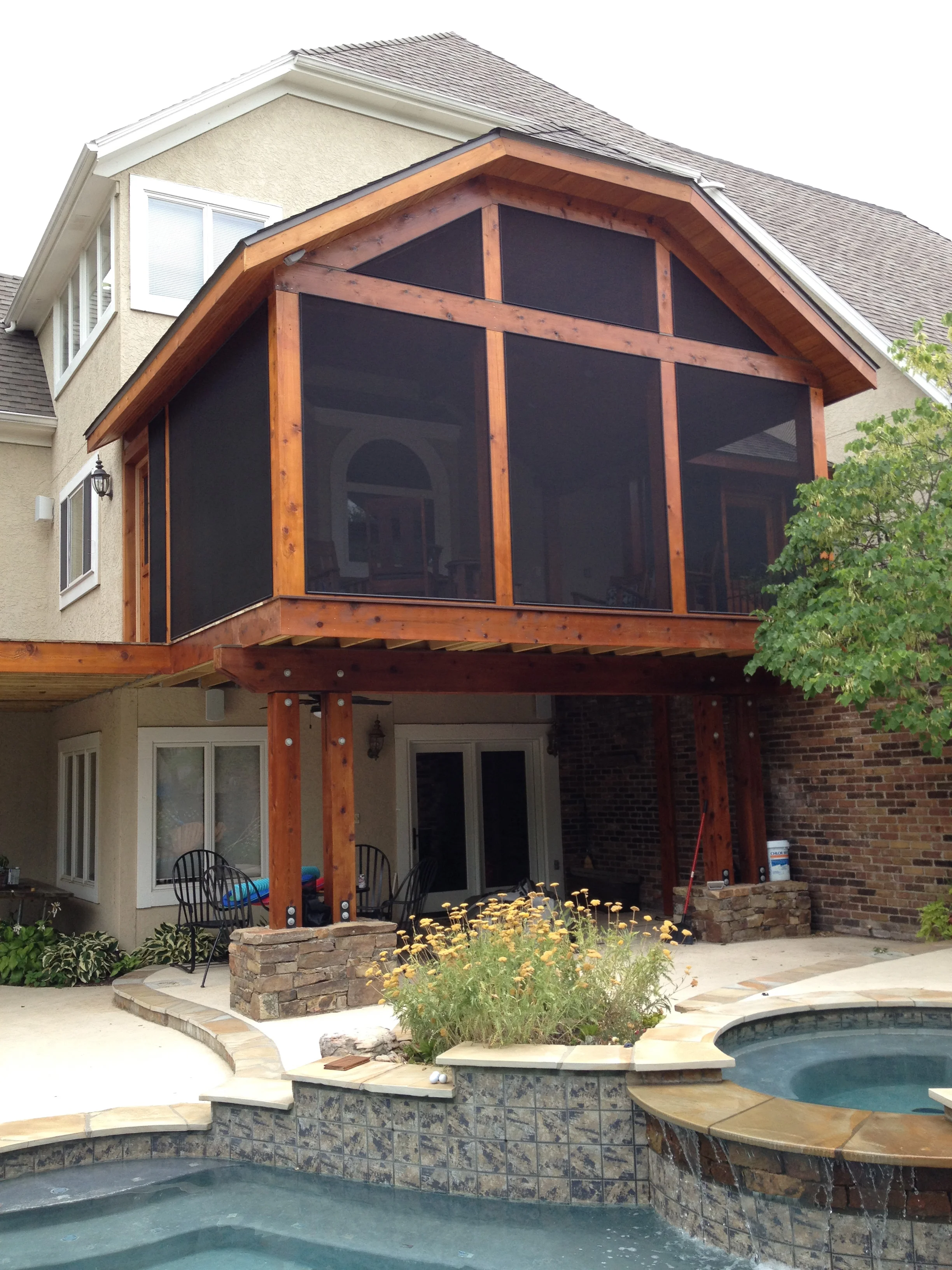 traditional outdoor living and pool on Screen Porch Ron Cook Construction