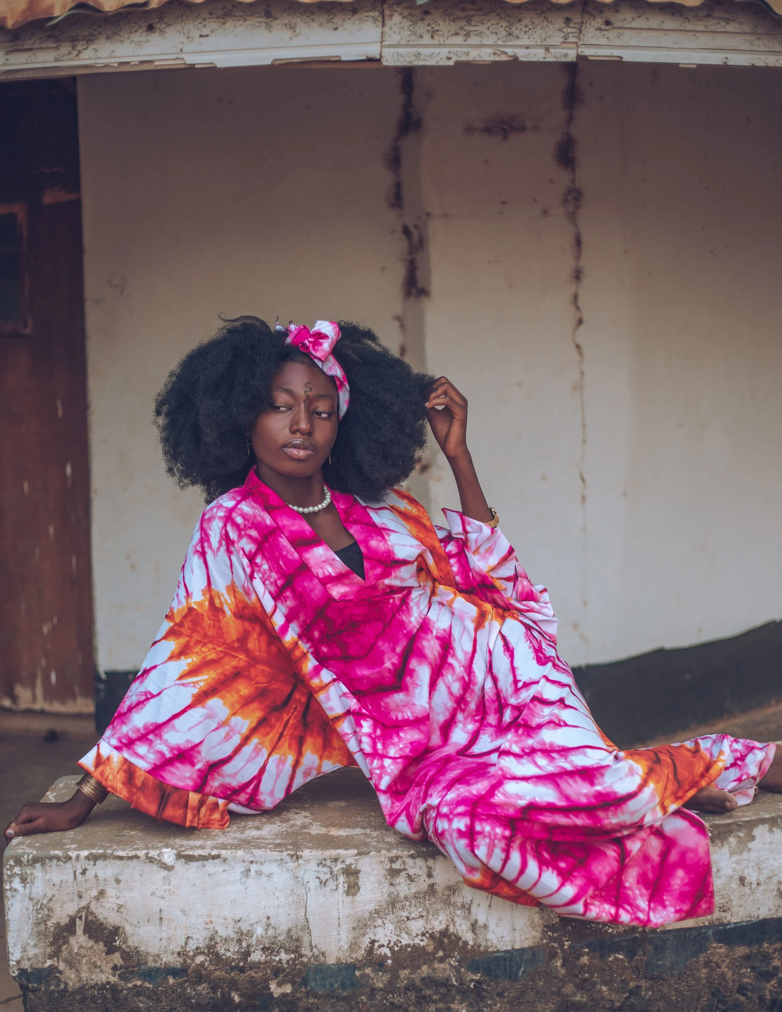 Stylish African Woman in Vibrant Tie-Dye Attire