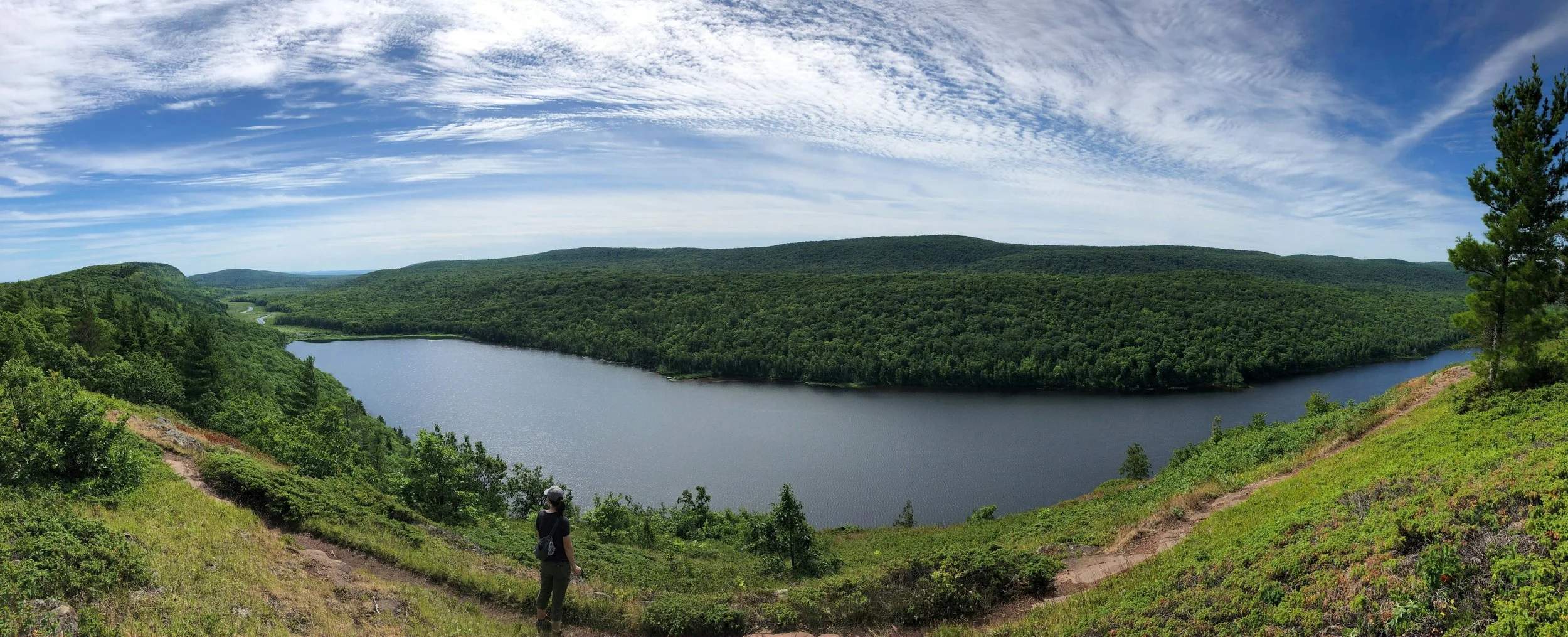 A hiking trail overlooking a lake in the Blue Ridge Mountains