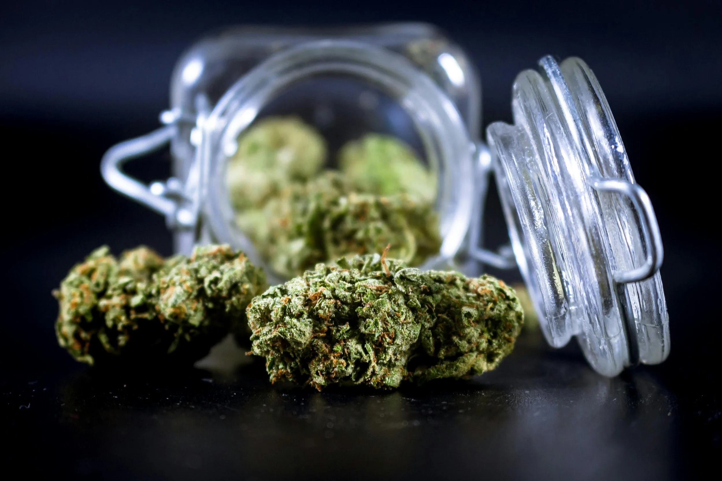 Cannabis flower in a glass jar in an adult-only recovery setting