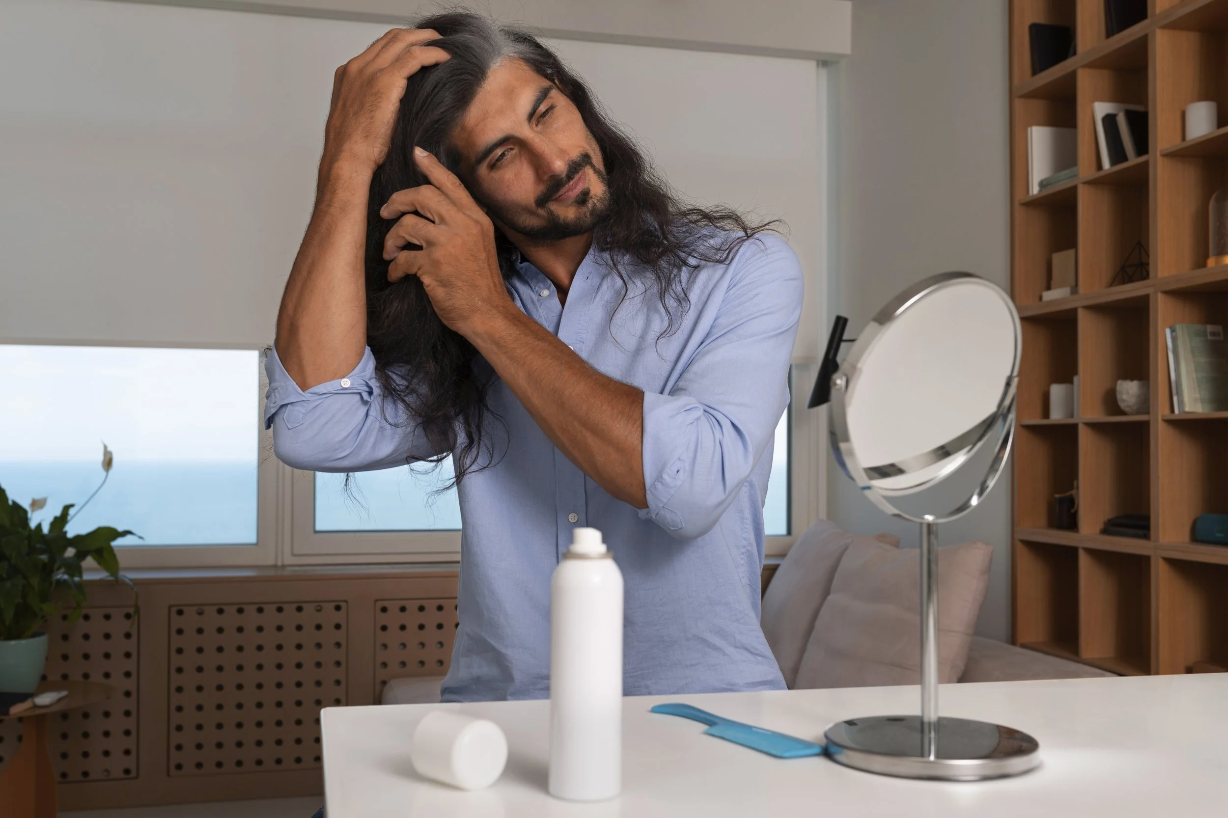 medium-shot-man-using-dry-shampoo-home.jpg