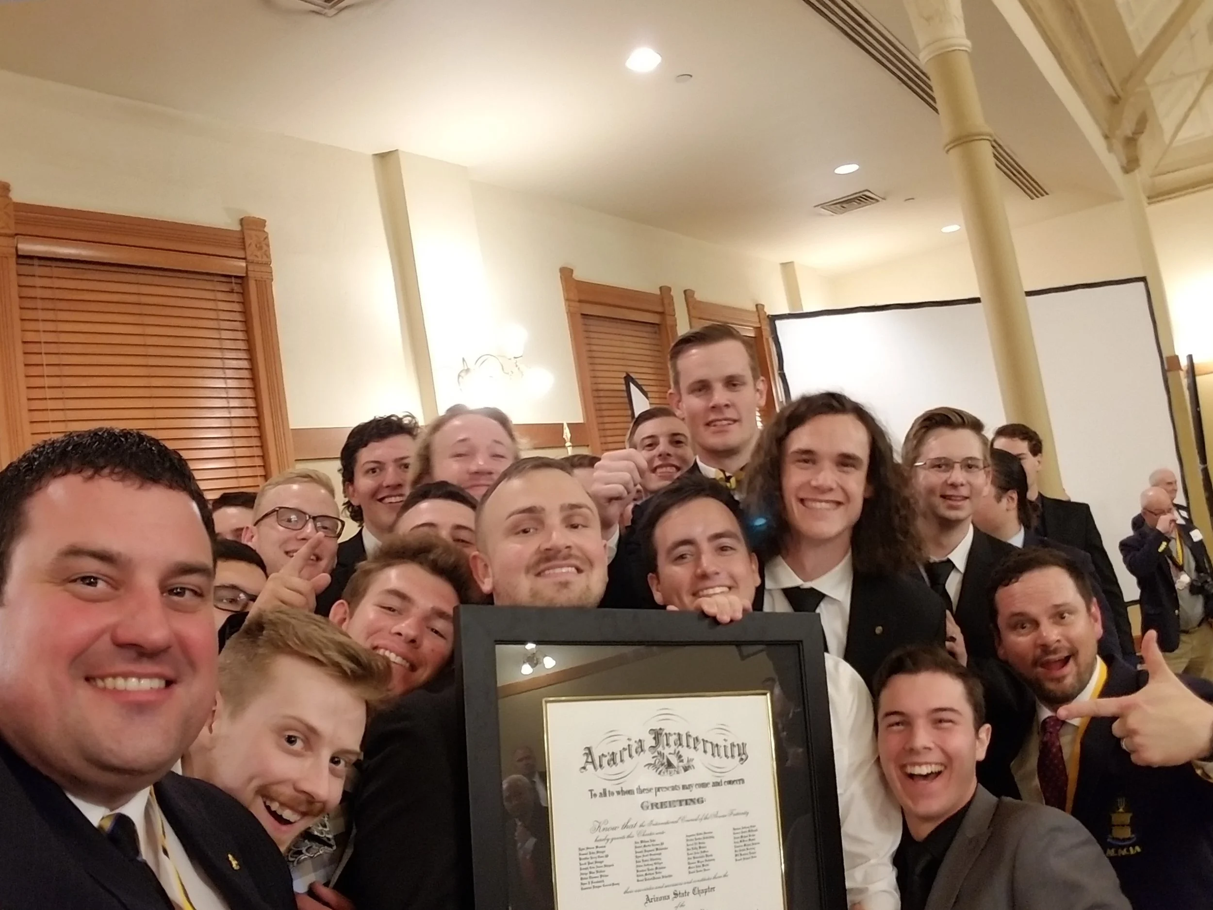 Arizona State members holding their charter with International President Jeremy Davis, Executive Director Patrick McGovern, and Director of Expansion and Recruitment Jerod Miles. 