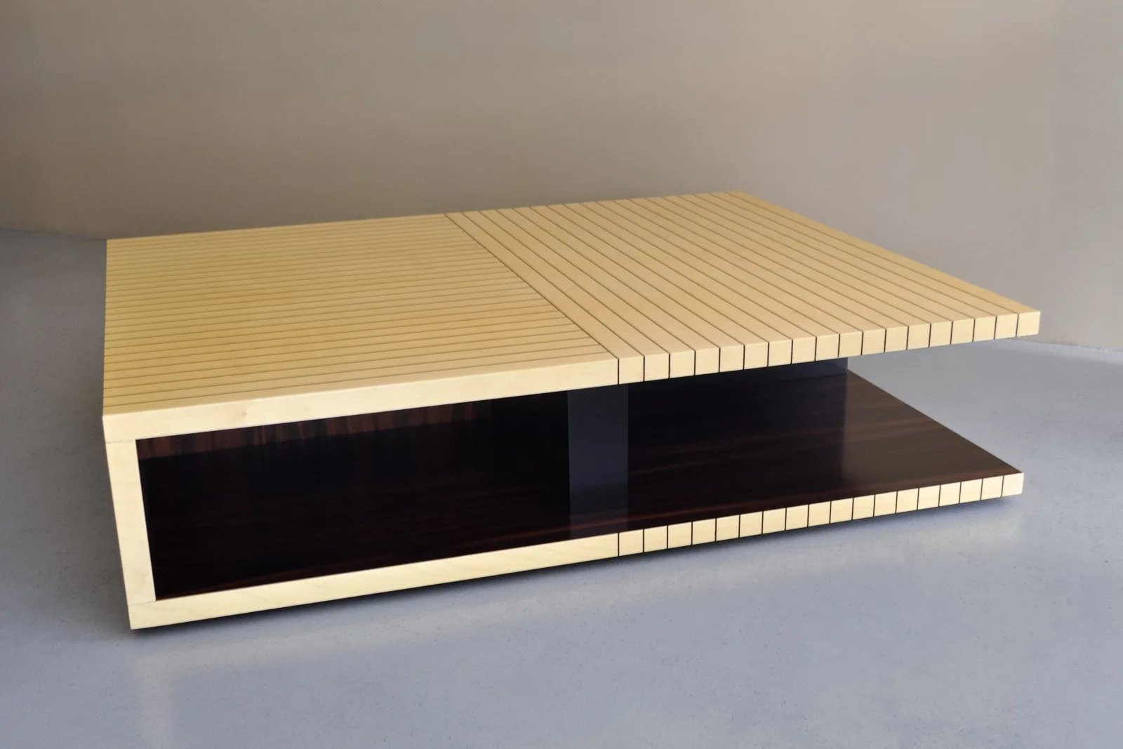 Low center table in ebony and sycamore with wood inlay geometric designs