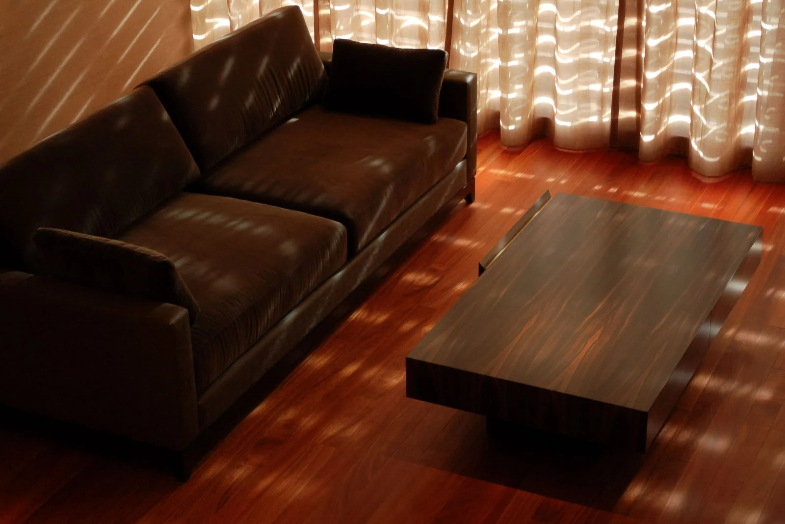 Warm toned iroko kambala flooring in a living room