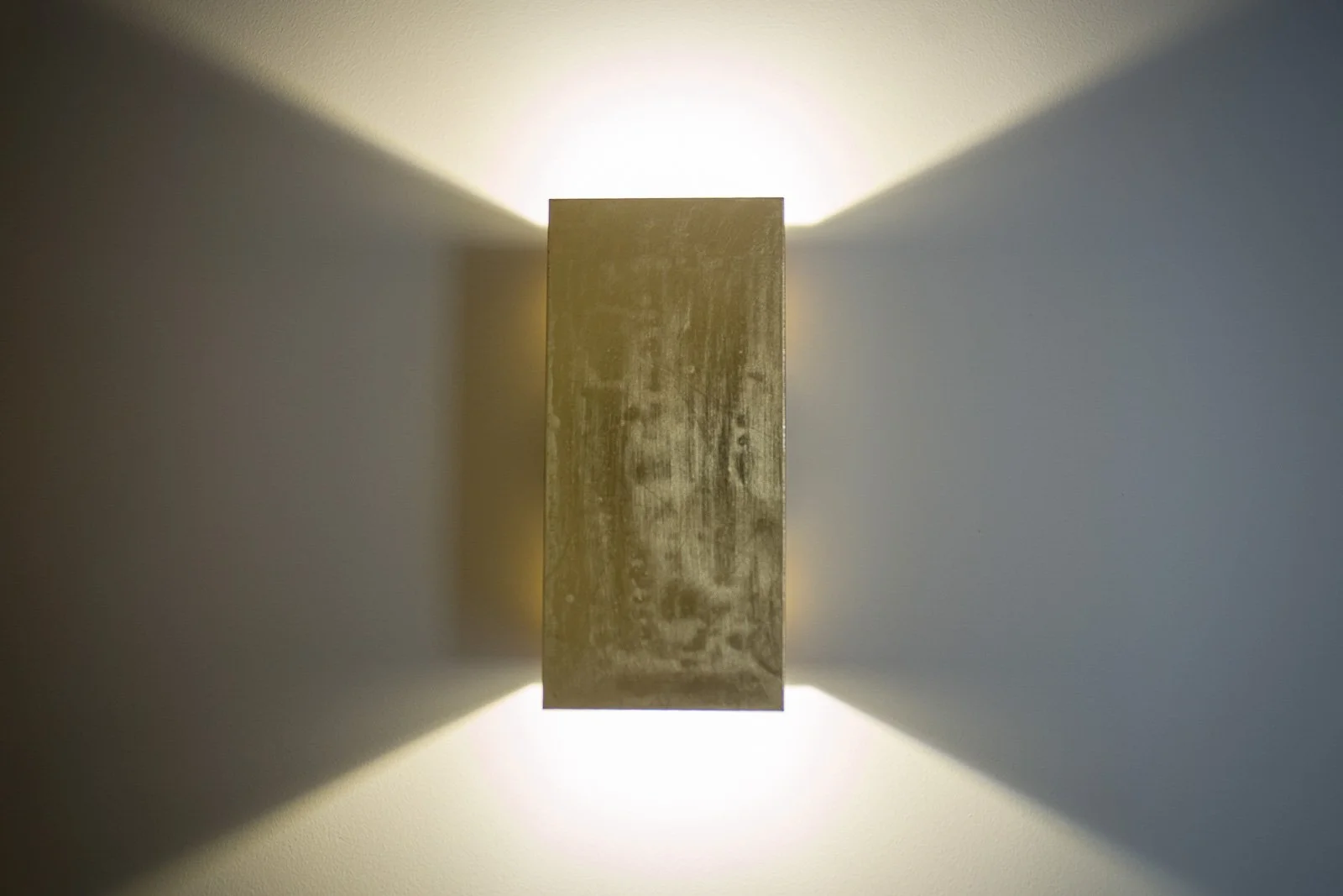 Detail of custom-made wall lamp with gold leaf application