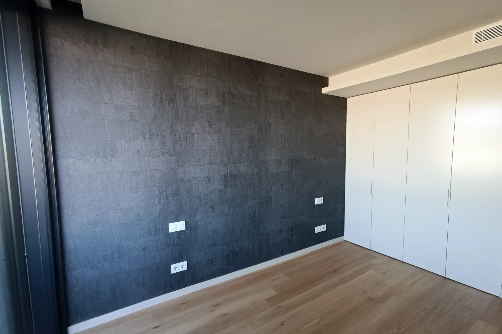 Embossed raffia weave dark blue vinyl wallpaper in bedroom