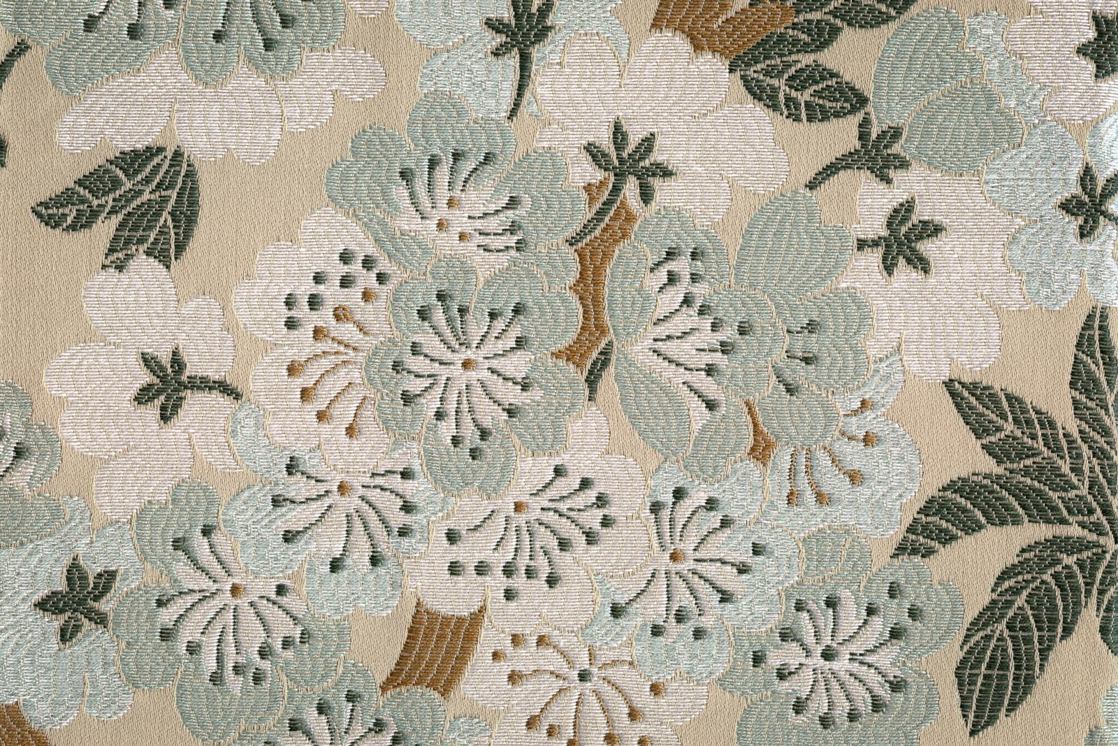 Detalhe de tecido italiano em jacquard, com padrão de flor de cerejeira, em tons verde-água