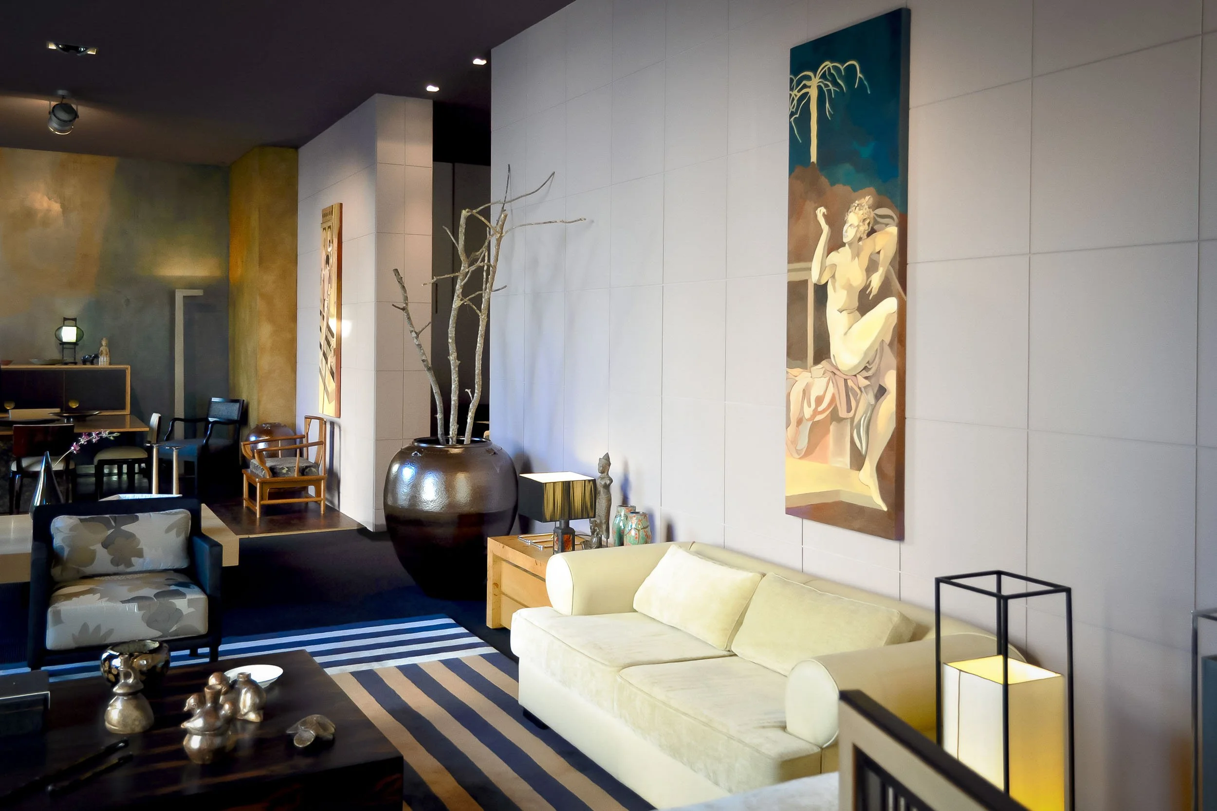 Modern living room interior at José António Andrade studio in Porto, Portugal — a contemporary design featuring custom furniture and rug, tailored upholstery, and a curated selection of objects.